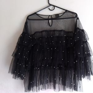 A black sher  with silver dots see threw size 3xs